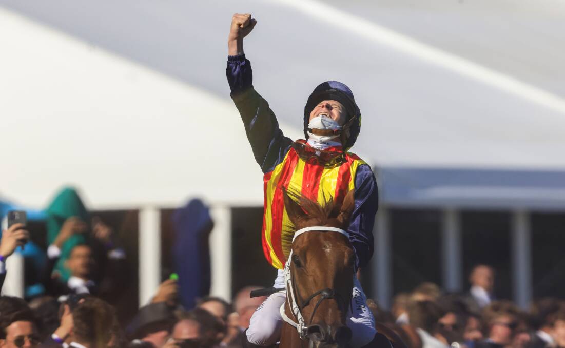 SALUTE: Jockey James McDonald looks to the sky after Nature Strip won the Everest in 2021 Picture: MARK EVANS/GETTY IMAGES