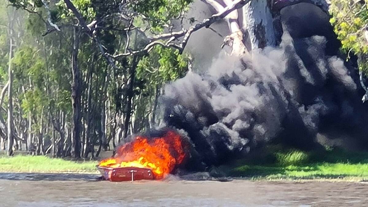 A speedboat well ablaze at Lake Charlegrark prior to being doused by CFA crews. Picture supplied.