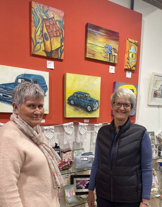 Liz Minne and Sue Ahern on duty in the Makers Gallery and Studio in Horsham in front of some of the artwork for sale.. Picture by Sheryl Lowe
