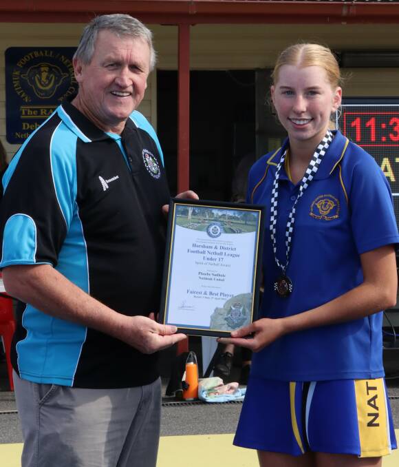 Phoebe Sudholz receives her Blue Ribbon Foundation Spirit of Netball award from foundation member Les Power. Picture supplied