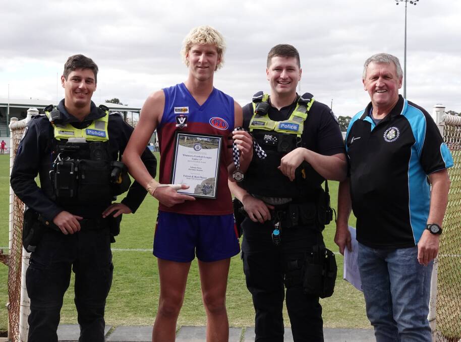 Horsham under 17s footballer Gibson Perry receives his Blue Ribbon Spirit of Football award from Horsham police officers Senior Constable Ethan Schilling, First Constable Jamie Thomas and foundation member Les Power. Picture supplied