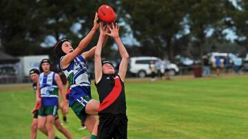 Kaniva Leeor United's Harrison Tink and Noradjuha Quantong's Jett Rowe compete in the 2023 HDFNL under 14s grand final. Picture by John Hall
