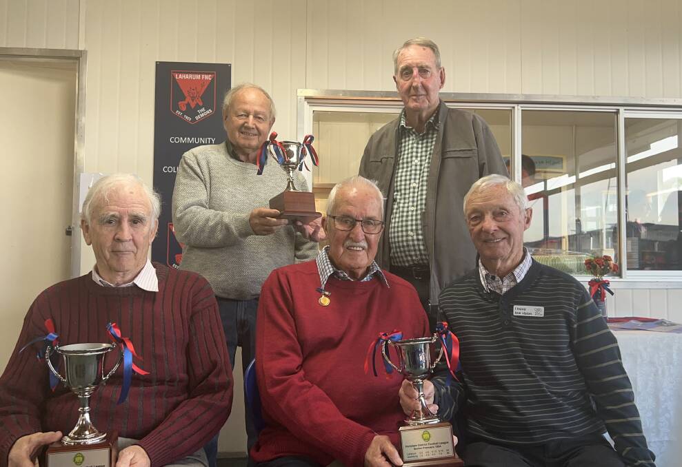 Laharum premiership players John Plazzer, Bob Hayes, Kevin Dunn, Rob Queale and Ivan Smith receive the spoils of their 1960s premierships. Picture by John Hall