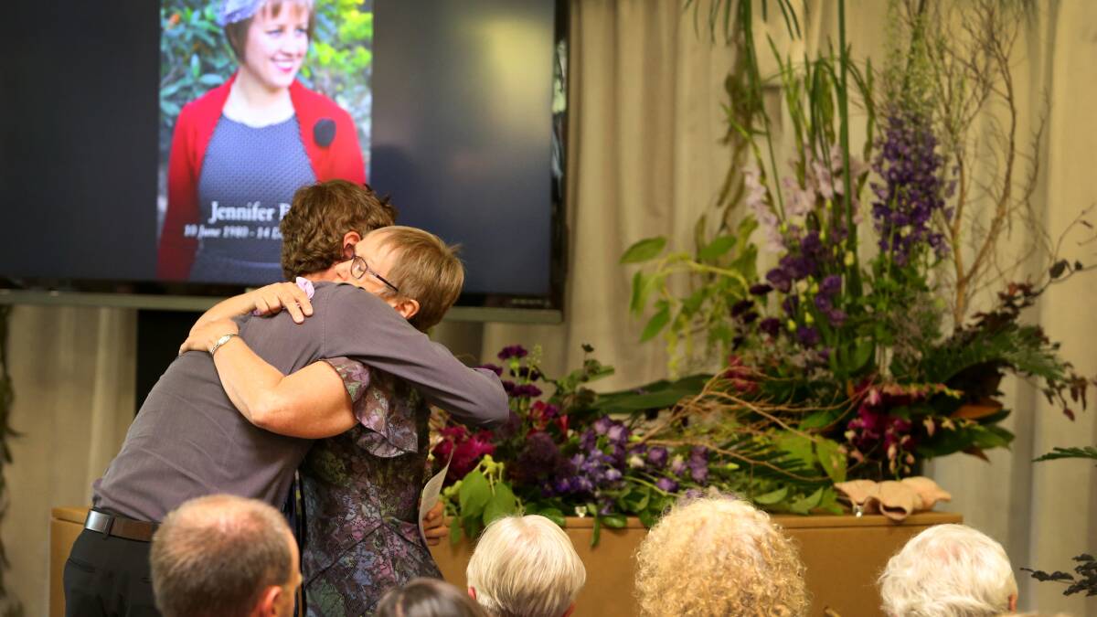 MEMORIES: Jordi Bates embracing Jennifer's mum, Kathryn Bennett, at Jennifer's funeral at the Hunter Wetlands Centre.