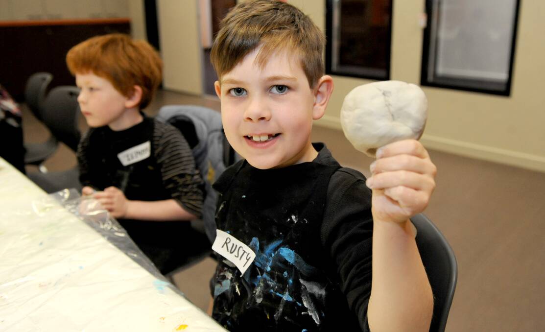 THUMBS UP: Rusty Vanstan, 8, shows off his clay creations at Horsham Regional Art Gallery. Pictures: SAMANTHA CAMARRI