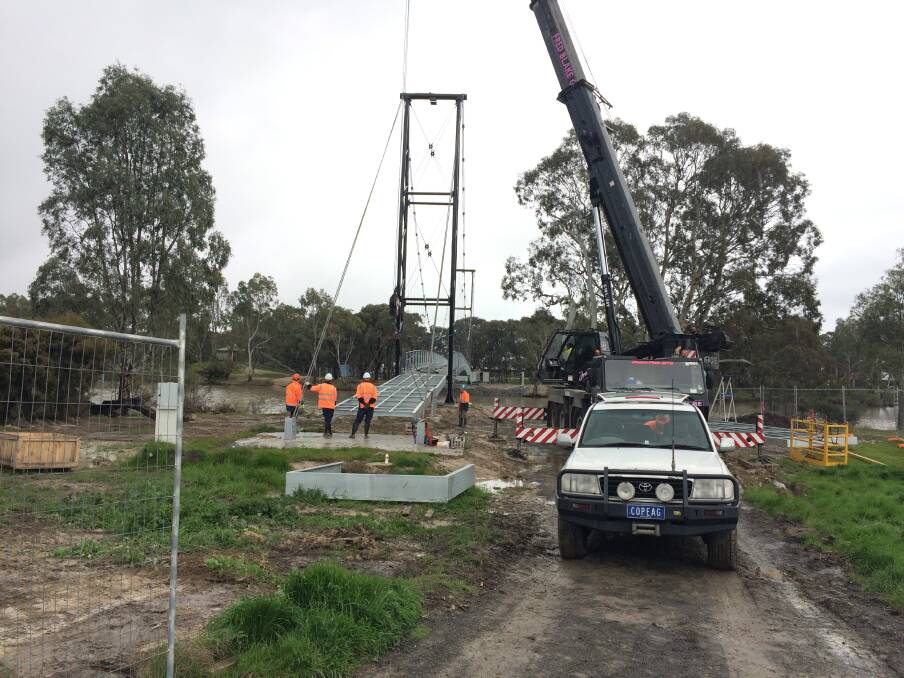 ON TRACK: Works at Horsham's Anzac Centenary Footbridge over the Wimmera River is continuing despite rain. The bridge should be finished in October. Picture: CONTRIBUTED