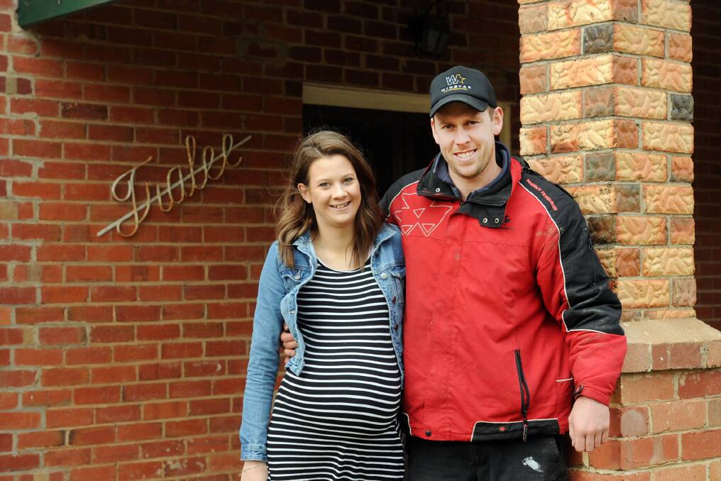 GROWING FAMILY: Alex Ellifson and Melissa Cosford are expecting their first child next month.