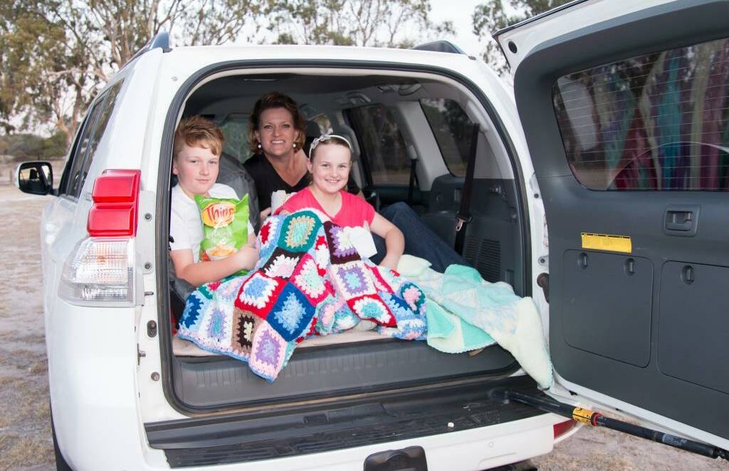 FAMILY: Sherridan Benbow and her children Tarkyn and Kody get ready Wimmera Uniting Care’s drive-in movie on May 20. Picture: BELINDA COOKSON 