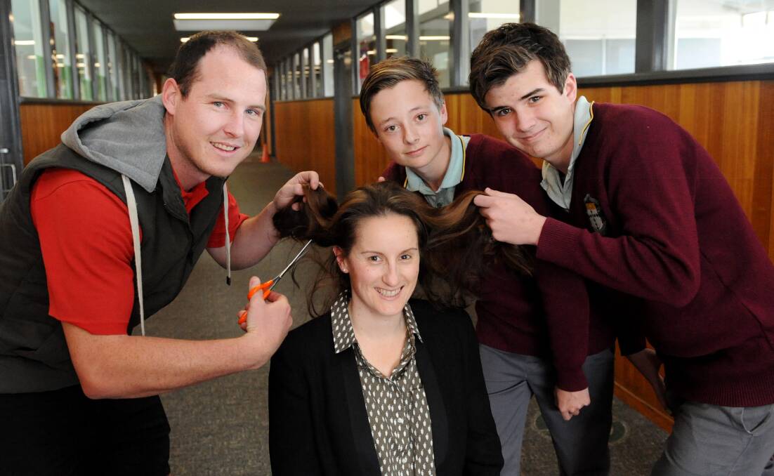 SUPPORT: St Brigid's College teacher Tom Magee, Jess Giampaolo and students Axel Fischer and Mitchell Johnson, will all shave their head. Picture: SAMANTHA CAMARRI