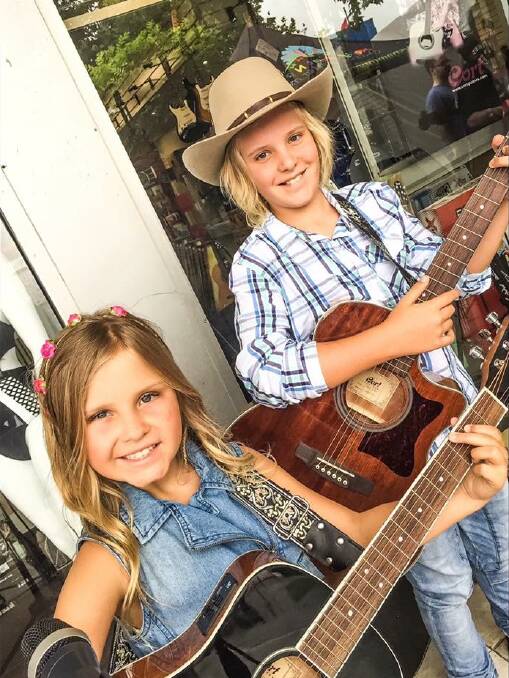 Georgie McGennisken, 9, and her brother Lachie McGennisken, 11, from Traralgon will perform in the Horsham Country Music Festival buskers competition. Picture: CONTRIBUTED