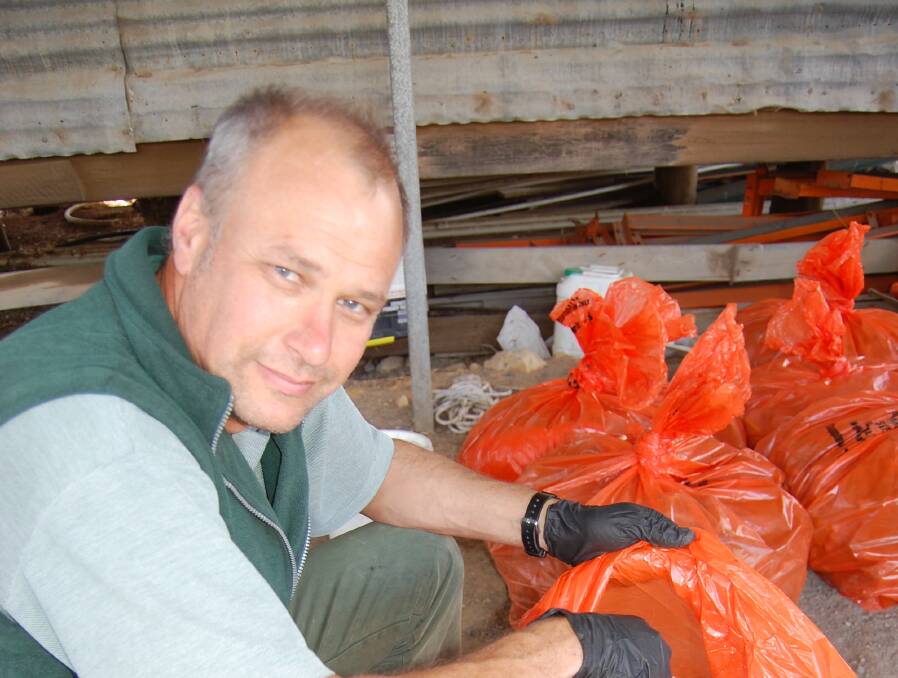 BOUNTY: Agriculture Victoria's Michael Moerkerk with fox scalps collected as part of the bounty. Picture: CONTRIBUTED
