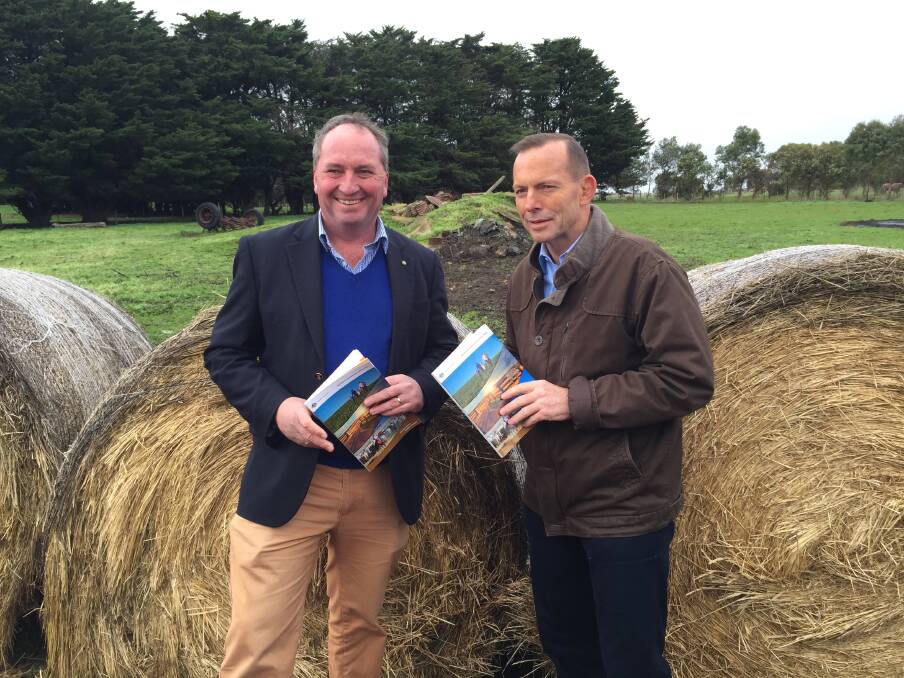 Agriculture Minister Barnaby Joyce and Prime Minister Tony Abbott release the federal government's Agriculture Competitiveness White Paper at a Woolsthorpe farm on Saturday. Picture: CONTRIBUTED