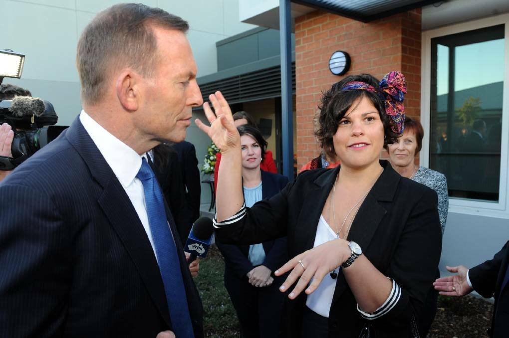 Murtoa's Rachael Littore, speaks to former Prime Minister Tony Abbott after he announced $1 million for the Wimmera Cancer Centre in 2015. Picture: PAUL CARRACHER