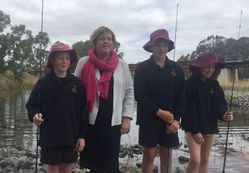 OPEN: Donald Primary School students Harry Forrest, 12, Will Burke, 12 and Mara Lobley, 12 try their hand at fishing at the newly opened Donald Weir Pool with Water Minister Lisa Neville. Picture: CONTRIBUTED