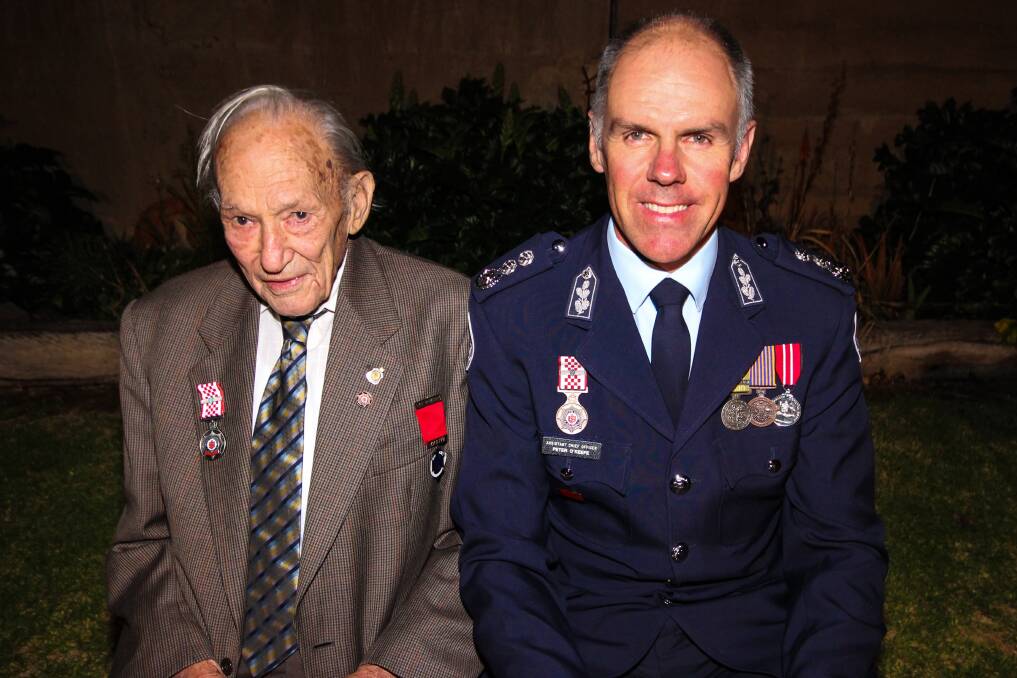 HONOUR: Kaniva's Jack Mills receives a 75-year service medal and life membership to the CFA. He is pictured with CFA assistant chief officer Peter O'Keefe. Picture: LEILANI WILLIAMS-BALE