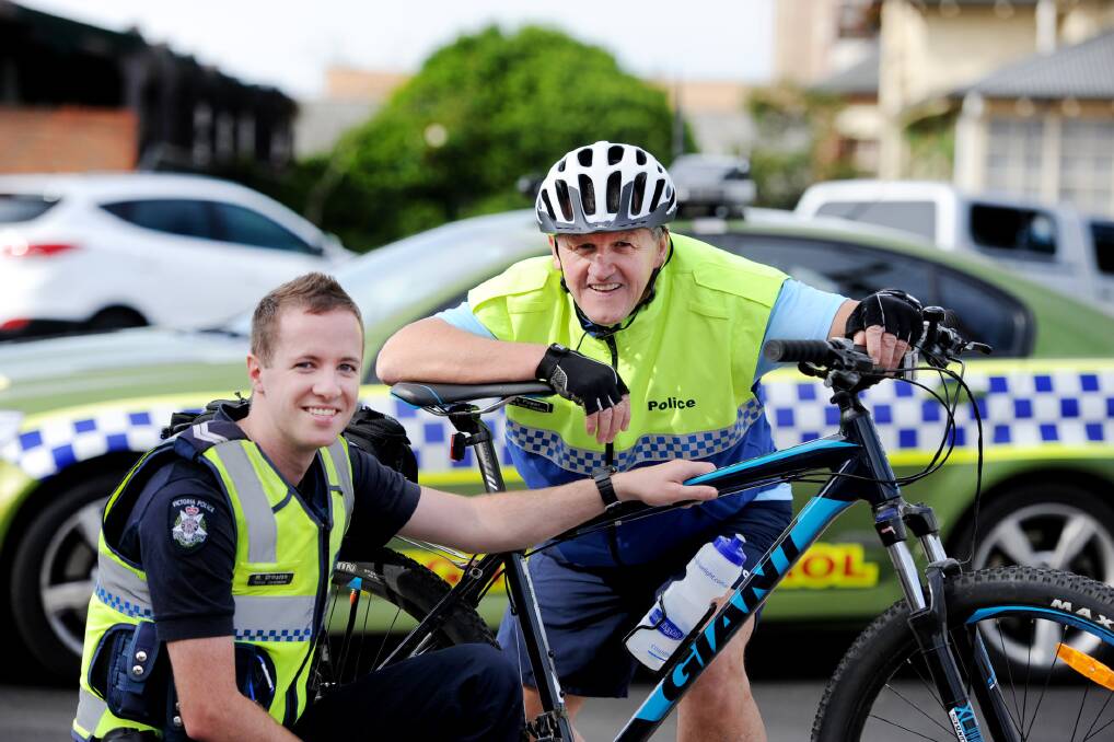 Senior Constable Matt Ormston and Senior Constable Les Power with bikes. Picture: SAMANTHA CAMARRI