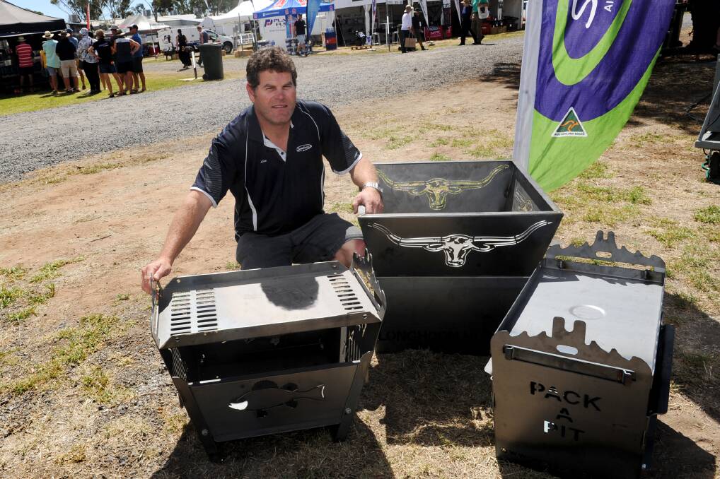 Smallaire's Jock Baker with fire pits up for grabs. Picture: SAMANTHA CAMARRI