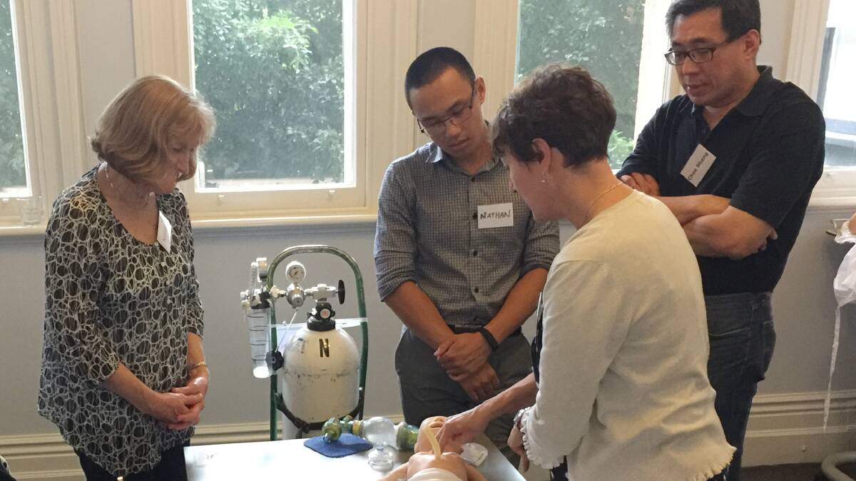 Kerry Sturmfels, Nathan Lay, Dr Chee Sheng Wong receive training from the MANE educator. Photo: Supplied