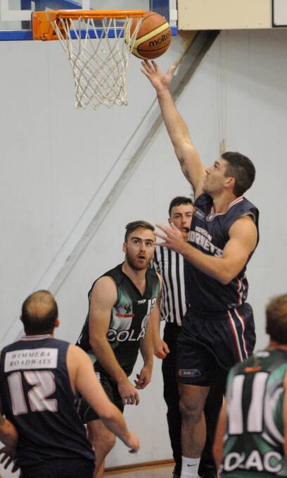LAY-UP: The Hornets' Tim Pickert shoots during Horsham's grand final loss against Colac in the 2014-15 season. Picture: PAUL CARRACHER