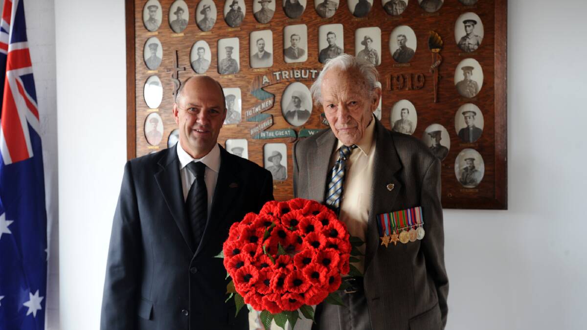 2015: Kaniva's Ross McFarlane and Jack Mills at the opening of the town's Anzac Day memoribilia display. Mr Mills is the town's last surviving Second World War veteran. Picture: ERIN McFADDEN