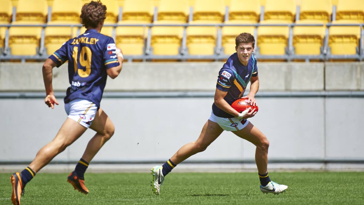 SWIFT: Darcy Tucker in action for the AIS-AFL Academy in 2014. Picture: AFL MEDIA