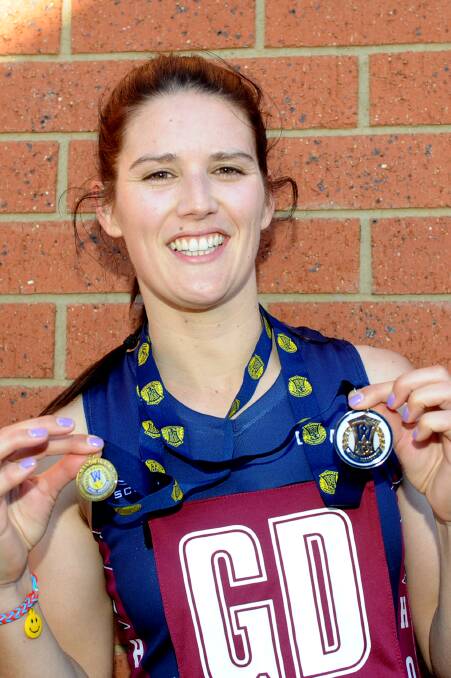 PROUD: Horsham co-coach Zoe Heard with her premiership and best-on-court medals from the Demons' flag triumph in 2014. Picture: SAMANTHA CAMARRI