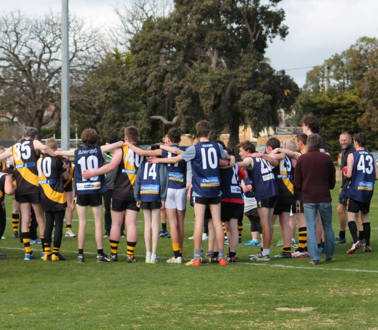 ARM IN ARM: Wimmera Whippets and Grampians Giants embrace after an enjoyable clash in Ararat on Saturday. Picture: PEPPE CAVALIERI