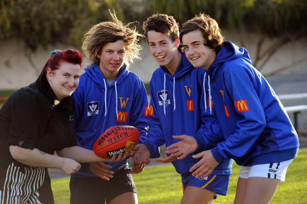READY TO PLAY: Anna Robarts, McDonalds, gives Wimmera players Thomas Berry, Angus Gove and Matty Lloyd some tips ahead of Wednesday's McDonalds Cup match against Ballarat. Picture: PAUL CARRACHER
