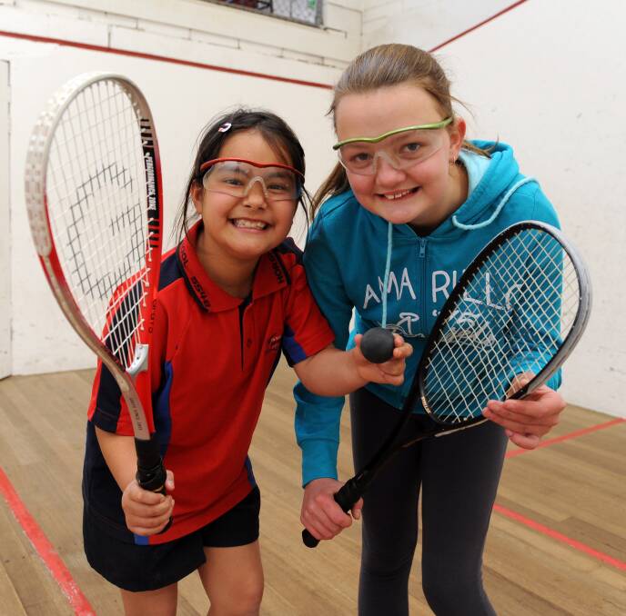 TEAMWORK: Cher-Leah Williams and Kyra Duffy have been enjoying the action at Horsham Squash Club. Picture: PAUL CARRACHER