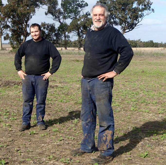 Glenlee, north of Dimboola in Victoria, farmers Adam and Greg Schwedes in a paddock of newly emerged Bonito canola, sown mid-May. 
