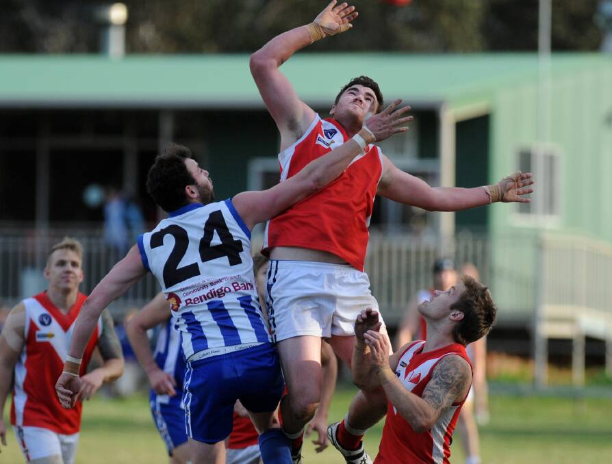 HIT-OUT: Harrow-Balmoral's Anthony Close in a contest with Taylors Lake's Dylan Carroll on Saturday. Close's five goals helped the Roos steam home for a 64-point win. Picture: SAMANTHA CAMARRI