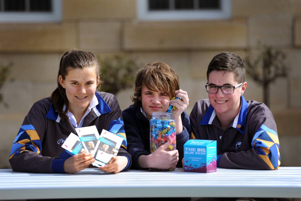 MAKING A DIFFERENCE: Warracknabeal Secondary College students Summer Schultz, year 12, Will Drago, year seven, and Sean Harris, year 12, have organised The Big Blue Bash at the college this week. Picture: SAMANTHA CAMARRI