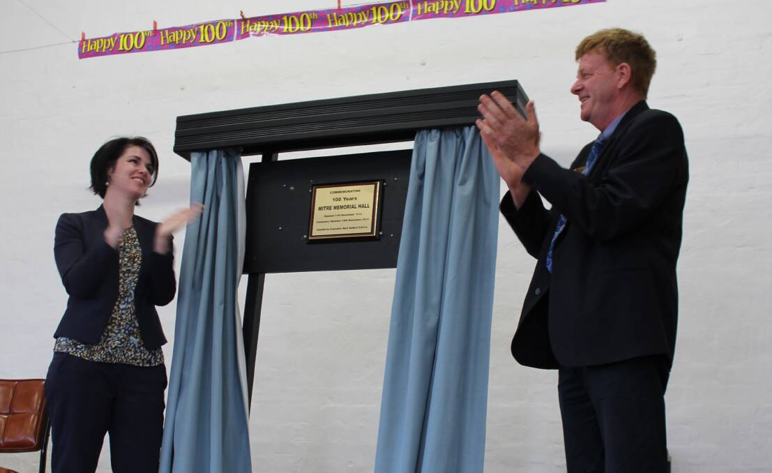 WARM APPLAUSE: Emma Kealy and Mark Radford unveil a plaque commemorating the 100th anniversary of Mitre Hall. Picture: CLARE DUNN