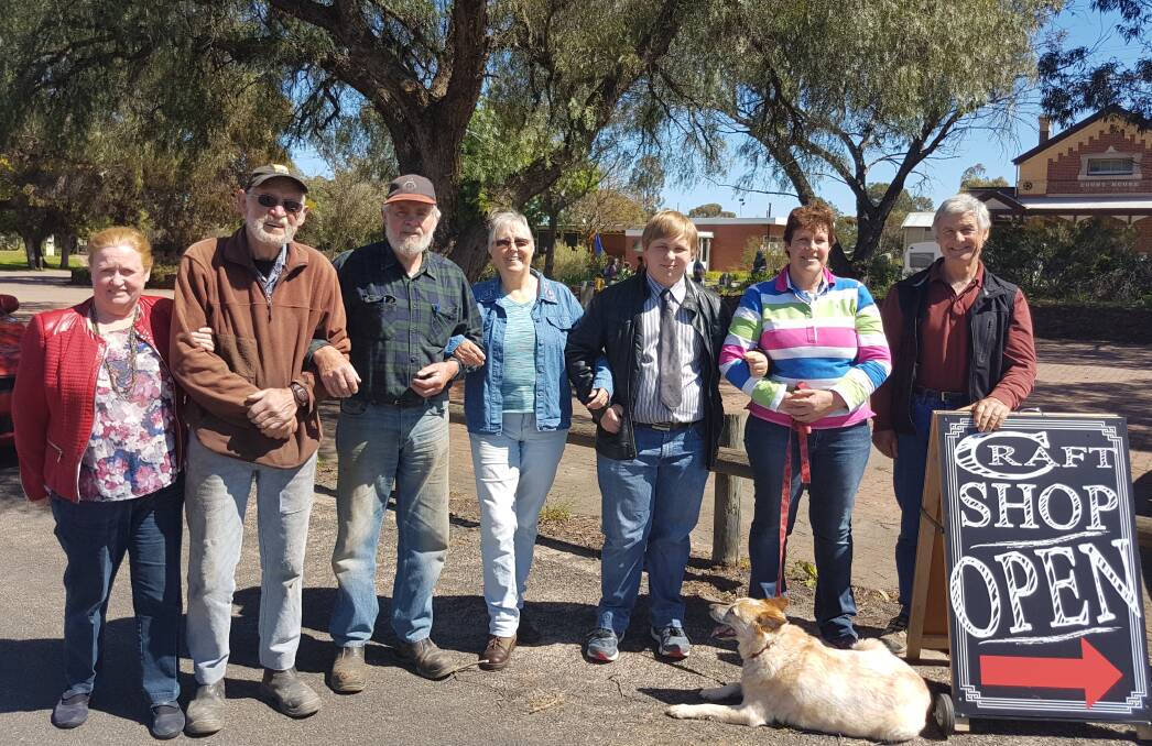 TEAM EFFORT: Judith Bysouth, Graeme Hateley, Mike Smith, Liz Smith, Rohan Schefe, Cathy Ryan and Keith Lockwood prepare for the market and trash and treasure day. 