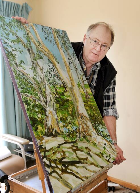 INTEREST: Artist David Louison with one of his paintings.