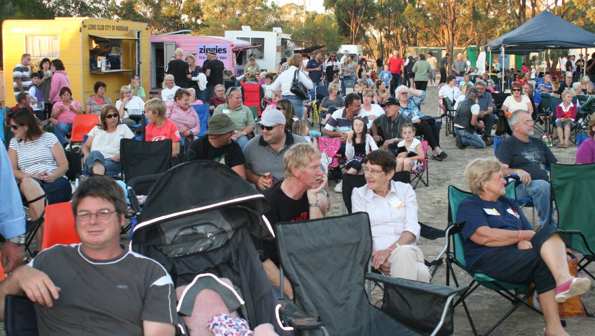 Crowds gather for the February 2010 market, which marked a year since the Black Saturday bushfires.
