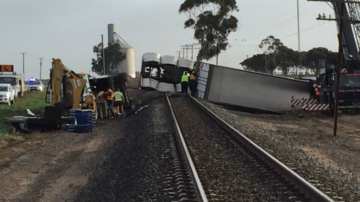 The rolled truck on the rail line west of Horsham. Picture: PAUL CARRACHER