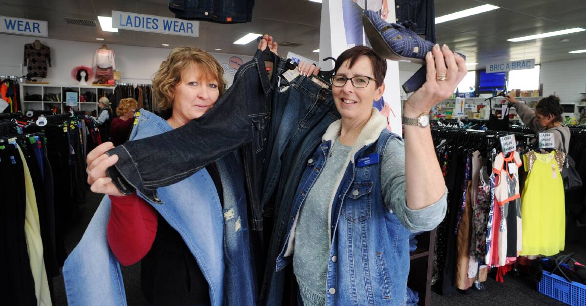 FASHION STATEMENT: Sheree Stonehouse and Sandra Marra getting ready for the Vinnies Denim Day on Friday. Picture: PAUL CARRACHER