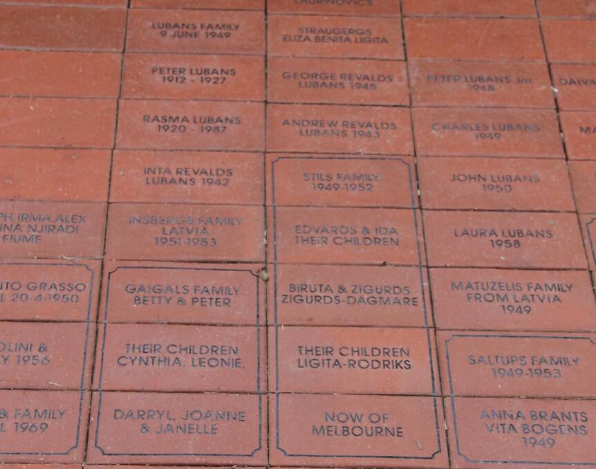 A pathway of bricks, with names inscribed, commemorates many of the migrants.