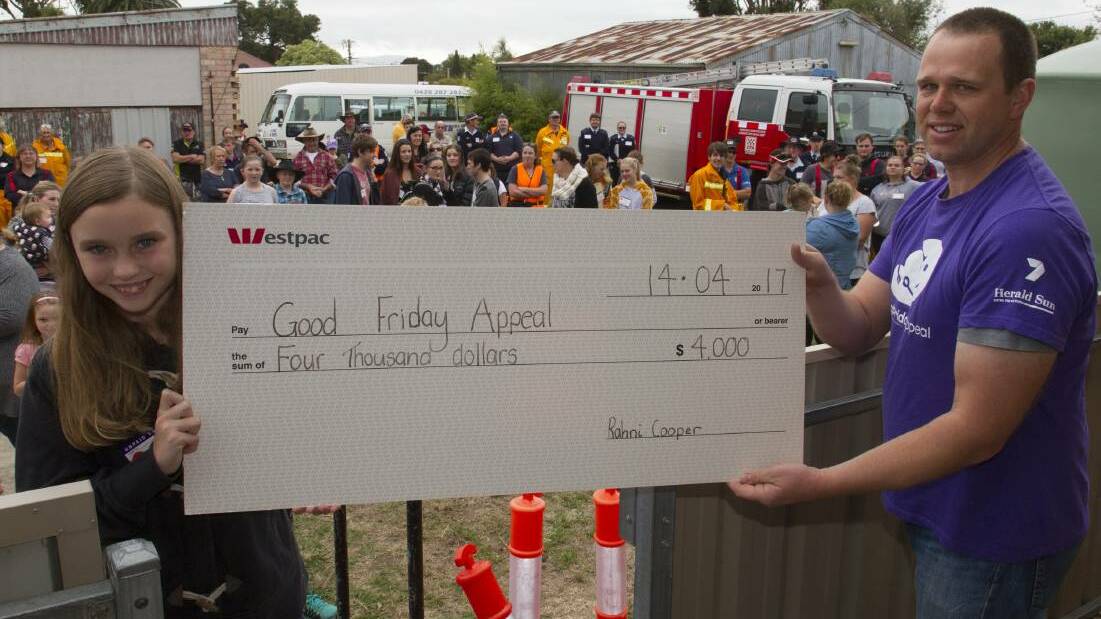 Rahni Cooper presents a big cheque donation to Graeme Cooper, area manager for the Ararat Royal Children’s Hospital Good Friday Appeal. Photo: Peter Pickering