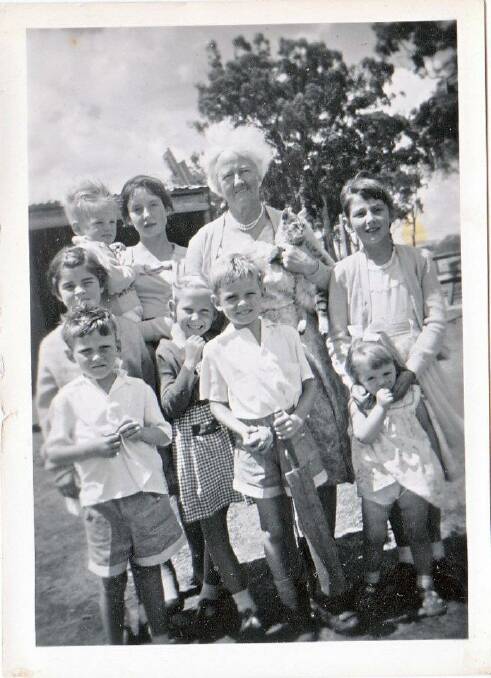 A family favourite, this is a 1958 photo of our blended family all dressed up for Sunday School. Some of his, some of hers, and some of theirs, with Grandma Ceclia Jean holding the cat.