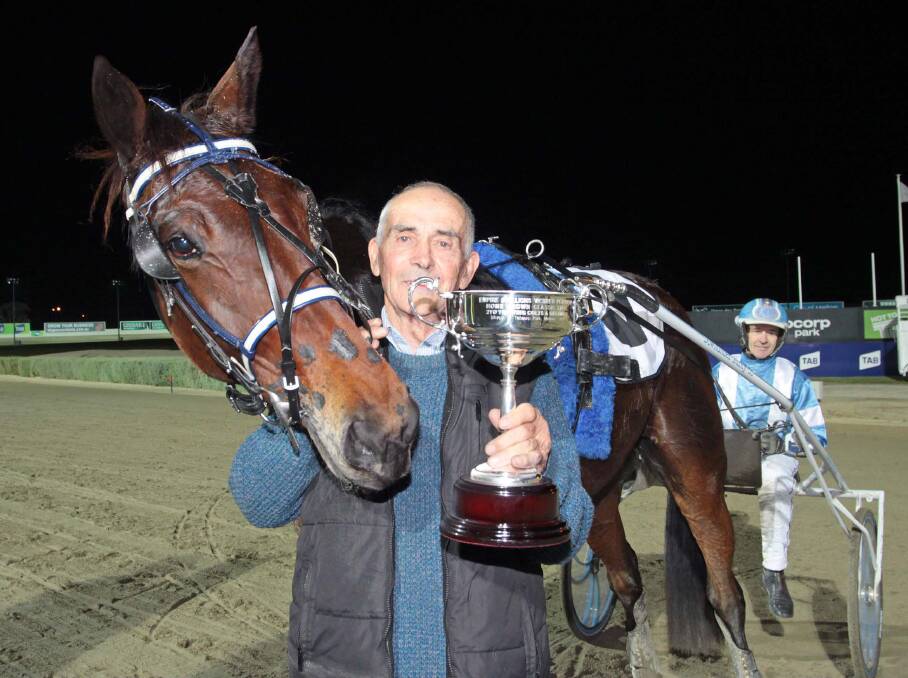 GLORY: Ararat trainer Terry Young with Deltasun and driver Gavin Lang following the group one victory at Melton last Saturday night.   
