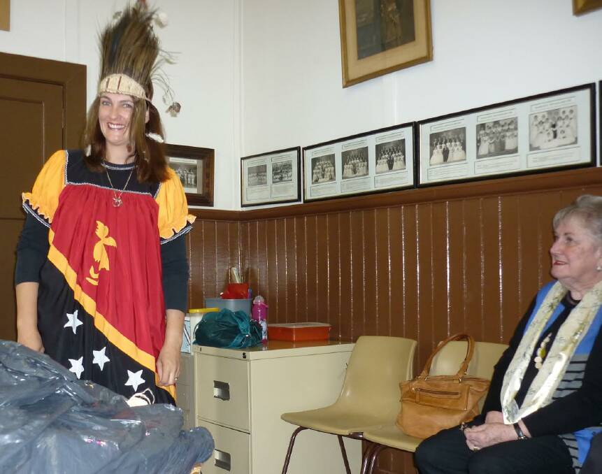 WELL DRESSED: Beulah CWA international officer Gay Sanders admires guest speaker Narelle Budd's Papua New Guinean outfit.