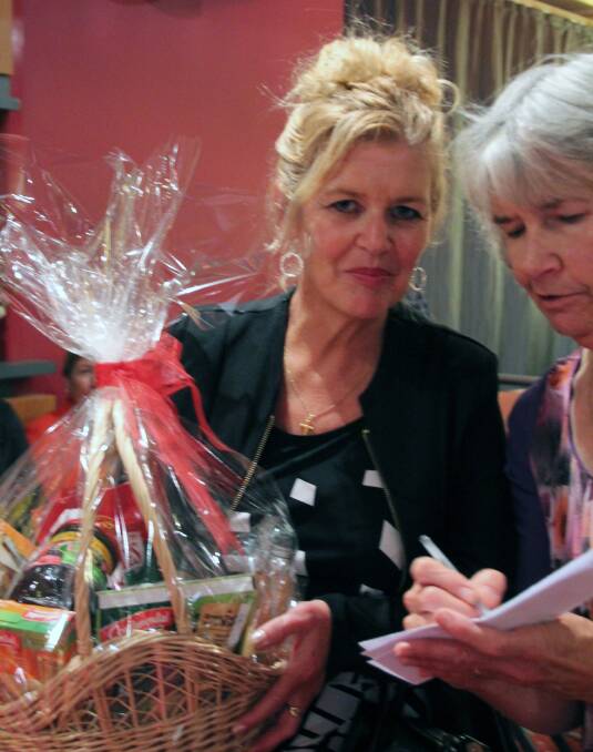 Third prize winner in the raffle, Suzanne Rivera is pictured collecting her prize from Stawell Hospital Auxiliary member Eleanor Reid during the fundraiser.