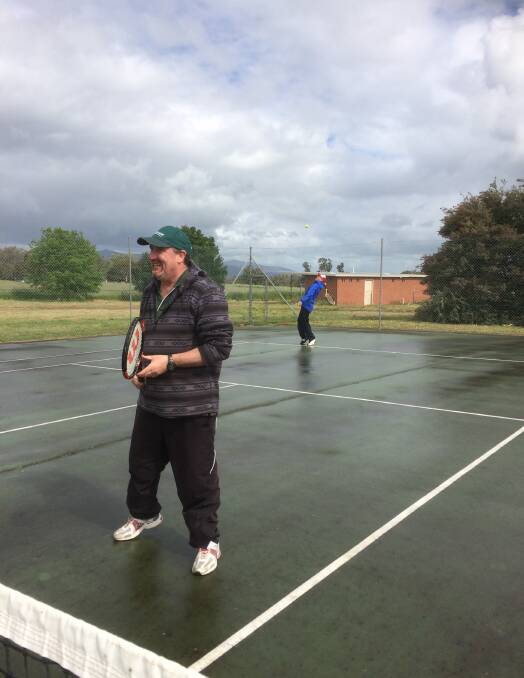 READY: Crowlands' Steve Jardine readies himself at the net while Keith Boatman serves during round two of the Ararat and District Tennis Association on Saturday. 