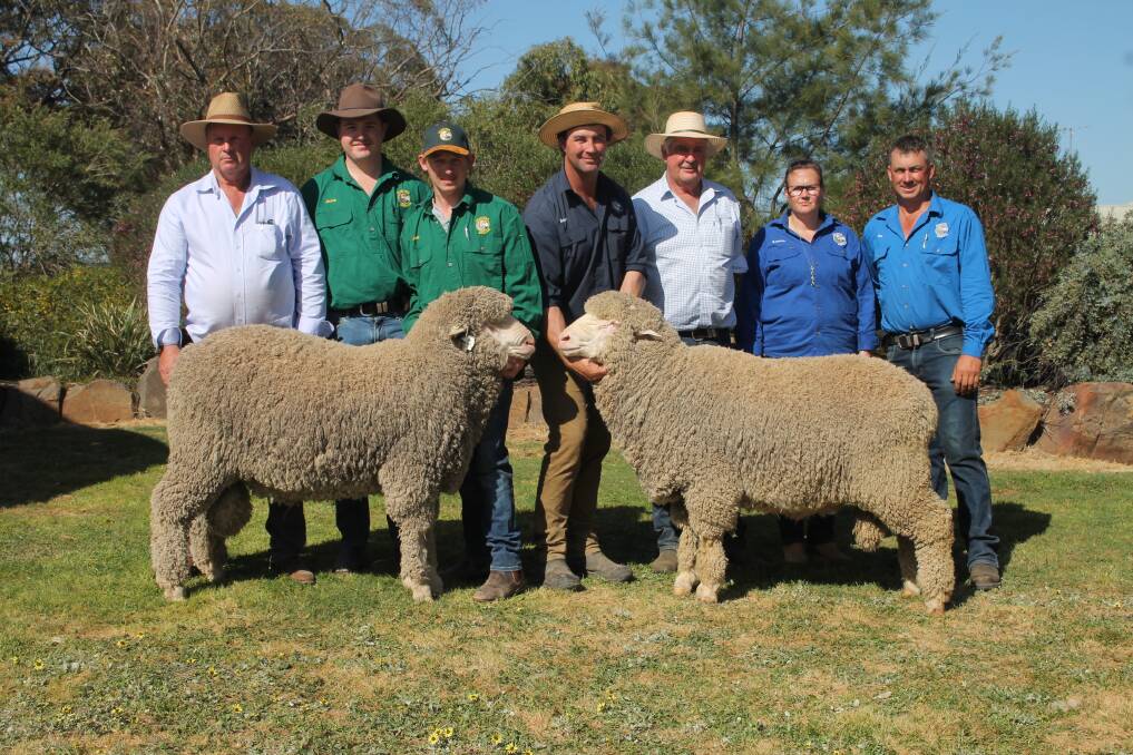 Roger Polkinghorne, Jesse Wandel and Josh Turnbull, Charinga Merinos, Berrimal, Brent Flood and Karina and Tim Polkinghorne, Banavie Merinos, Marnoo and Andrew Calvert, Wool Solutions, with top-priced rams Lot 57 Caringa 220657 and Lot 2 Banavie 220223 which sold for $17,000 and $30,000. Picture by Philippe Perez