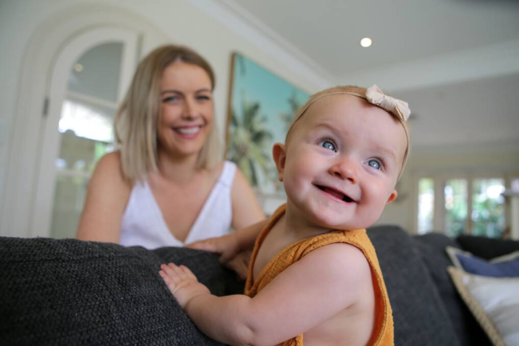 Happy mum, happy bub: Katie Honan with Bella, who has had reflux since she was born, is smiling again after getting treatment. Picture: John Veage
