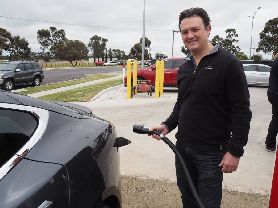 CHARGING: Tesla car owner Brad Clark stopped at the new charging station on his way to Hornsdale in South Australia. Picture: DAINA OLIVER.