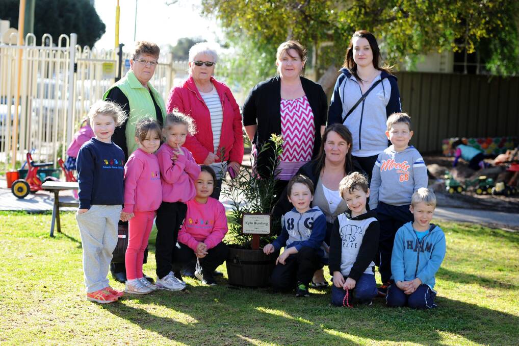 IN MEMORY: Jaxon Bunting with his family and kinder friends after he planted a tree at Horsham's Roberts Avenue Kindergarten in memory of his father. Picture: SAMANTHA CAMARRI
