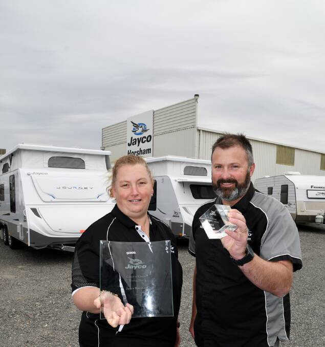 WINNERS ARE GRINNERS: Jayco Horsham sales manager Donna Krelle and owner Richard Clarke with their awards. Picture: SAMANTHA CAMARRI